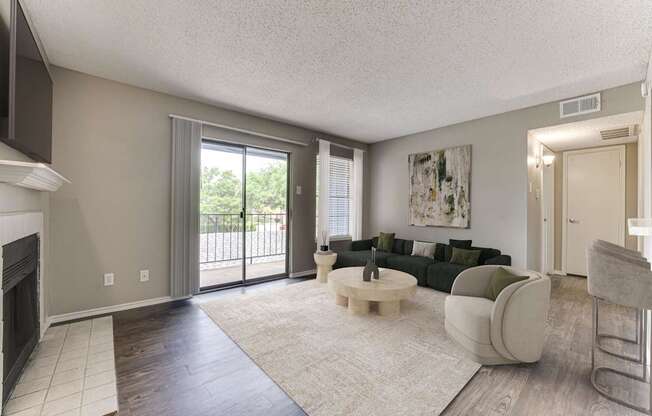 A living room with a fireplace and a couch.
