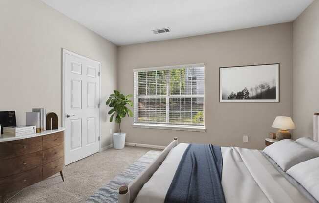 Bedroom with a large bed and a window