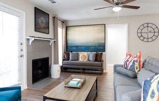 Living room with fireplace at Creekside at white oak in Newnan, GA