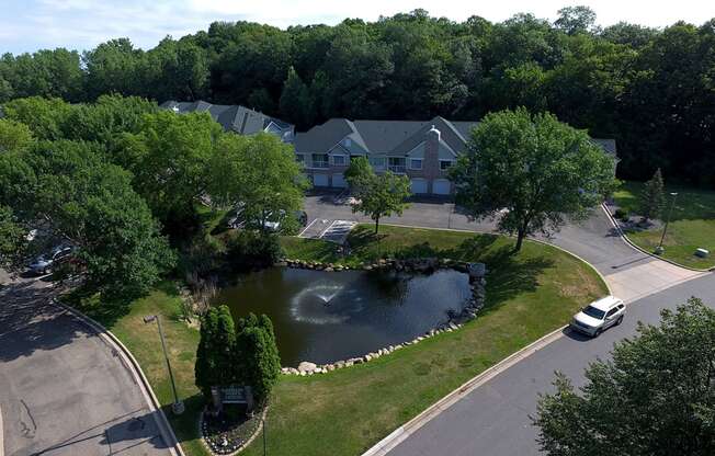 a house with a pond in front of it