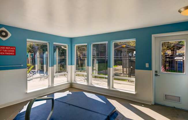 a dining room with windows and a table