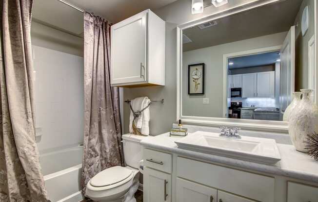 a bathroom with a toilet sink and bathtub