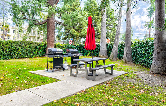 Barbecues and seating area adjacent to the private park.