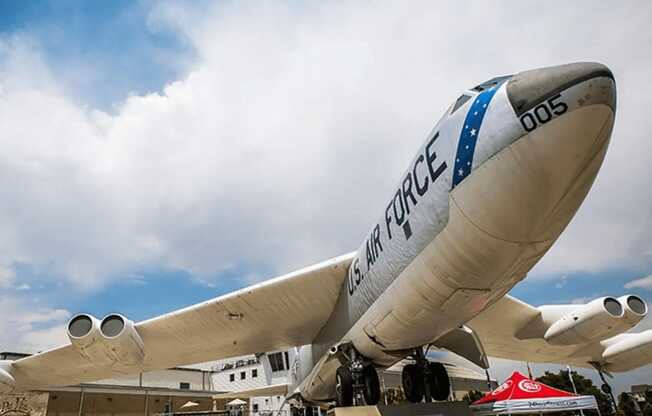 a large air force plane on display at an airport