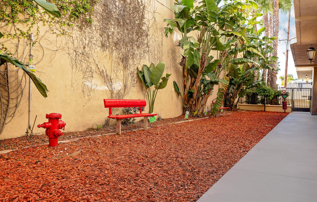 Pet friendly amenity with red bench and fire hydrant