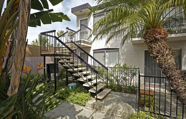 FABULOUS location!  4 blocks to the ocean & Sail Bay, AIR-CONDITIONING, IN-UNIT LAUNDRY! PRIVATE GARAGE + Addn Parking