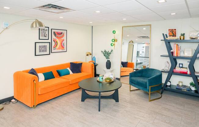 A living room with a sofa, armchair, and coffee table.