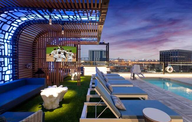 Unique lighting features under the shade structures transform the rooftop pool deck into an evening lounge that offers sparking views of San Diego and the bay beyond