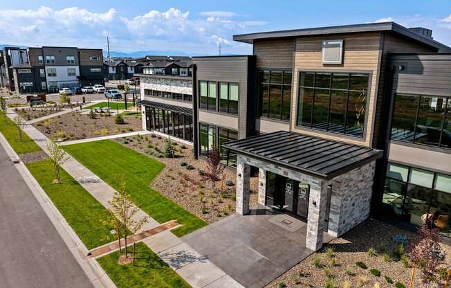 an aerial view of a building with a courtyard and grass