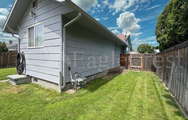 Three Bedroom, Two Bathroom House with Fenced Yard and Outdoor Fireplace