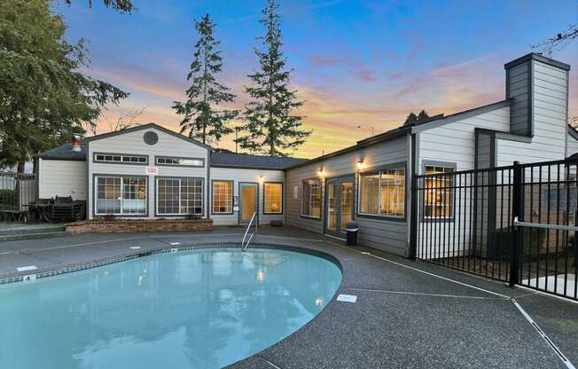Novela Apartment Homes Pool Area and Clubhouse at Dusk
