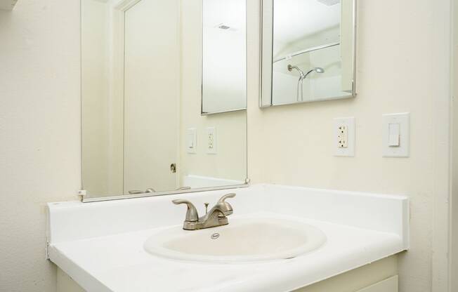 a bathroom with a sink and a mirror at Sagewood Gardens Senior Apartments, Hacienda Heights, 91745