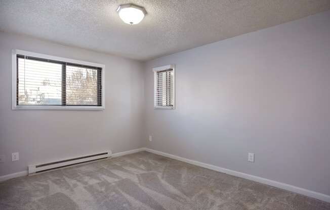 Living room of an empty house with a window  at Governor's Park, Fort Collins, 80525