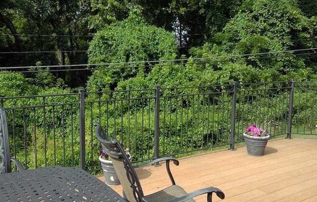 a patio with a table and a chair