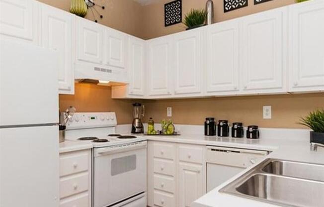 White Cabinetry And Appliances In Manchester Place Kitchen in Georgia Rentals