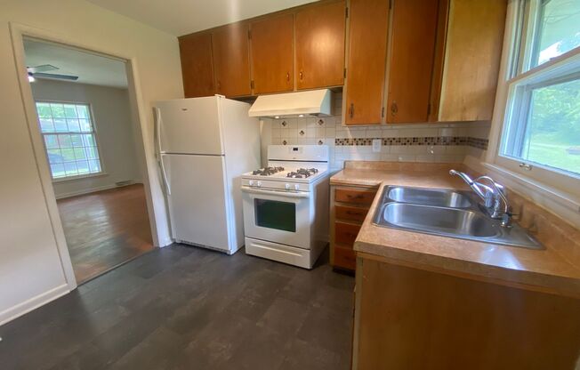 Charming 3-Bed Rental Home with Wood Floors & Serene Backyard!