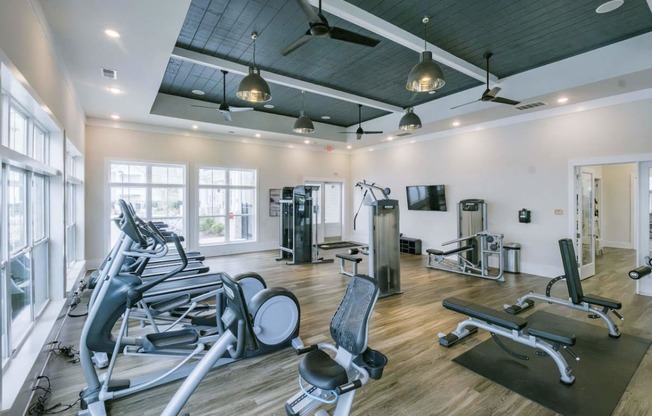 the gym is equipped with state of the art equipment including weights and cardio machines