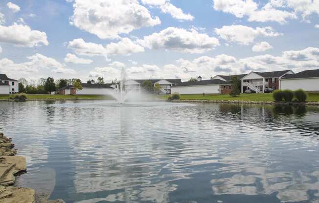 This is a photo of a fountain in a pond at Washington Place Apartments in Washington Township, OH
