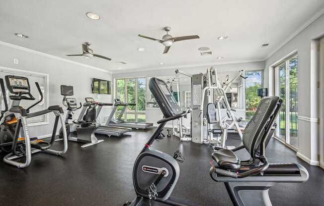 A spacious home gym with a variety of exercise equipment.