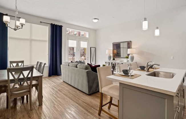 a living room and dining room with a couch and a table at 200 City View, Utah, 84601
