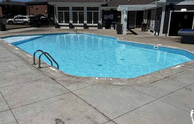 a swimming pool in the middle of a hotel pool