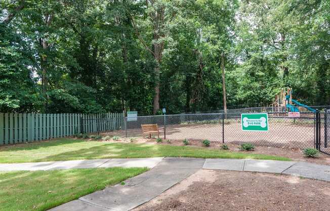 A sign in a park reads "Sunset".