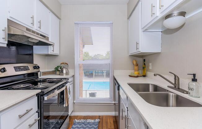 a kitchen with a stove and a sink