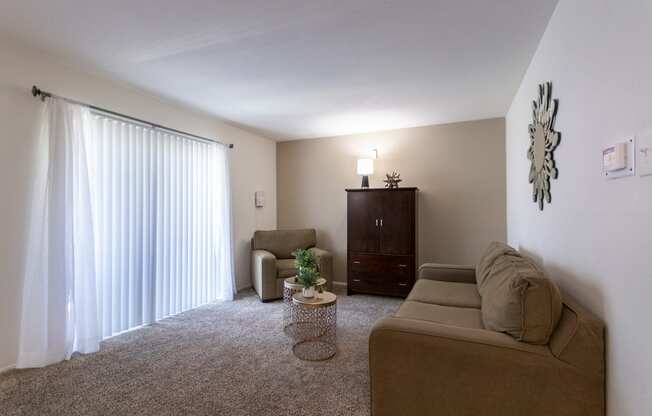 This is a photo of the living room of the 590 square foot 1 bedroom, 1 bath model apartment at The Biltmore Apartments located int he Vickery Meadow neighborhood of Dallas, TX.