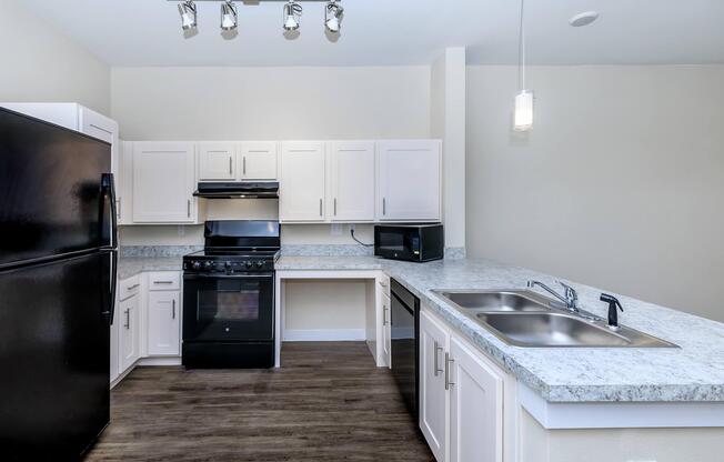 Apartments for Rent in Leander TX - Hills at Leander Spacious Kitchen with Plenty of Counterspace, Fully Equipped with Black Appliances, and Much More