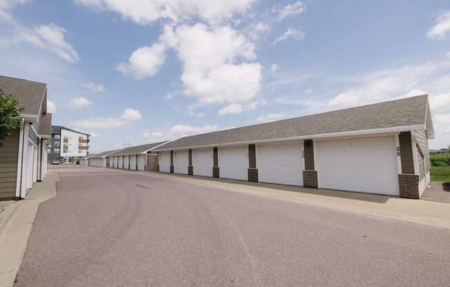 A long row of garage doors are closed.