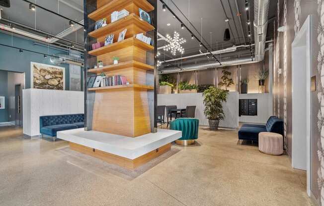 A modern office space with a tall bookshelf filled with books and a white platform at the base.