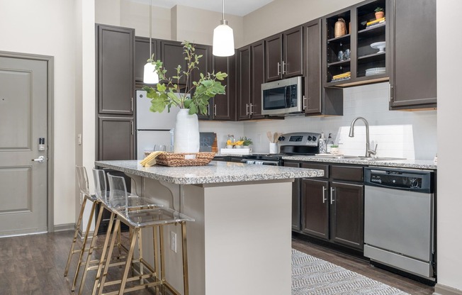 Open Living Room and Kitchen at RiverHouse Apartments in Little Rock, AR