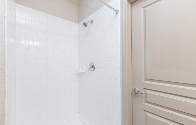 a close up of a shower in a small room