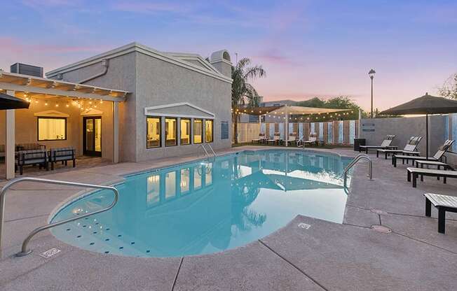 Community Swimming Pool with Pool Furniture at Ridgeline Apartments in Tucson, AZ.