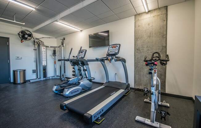 Portland, OR Apartments for Rent - Corbett Heights Fitness Center with an Exercise Bike, a Treadmill, and an Elliptical