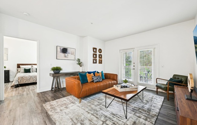 Living room with brown leather couch and coffee table