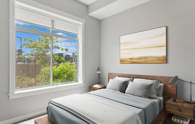 Model Bedroom with Carpet and Window View at Seven Skies Apartments located in Sandy, UT.