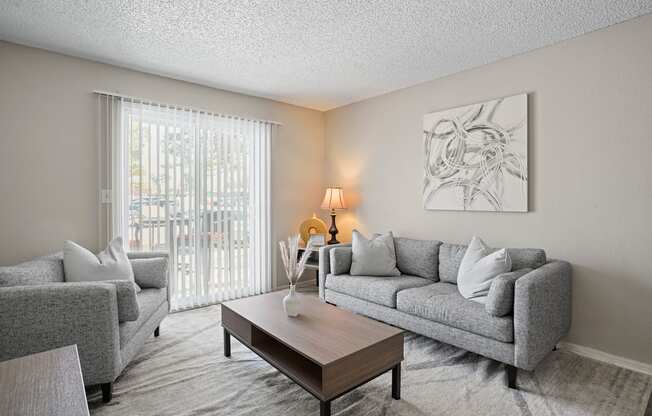 a living room with couches and a coffee table