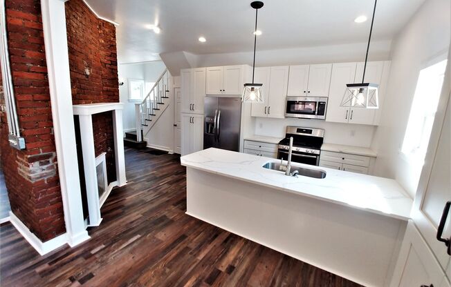 GORGEOUS, large 3 bedroom stand alone house w/ master suite, quartz, stainless, a/c, laundry, and parking!