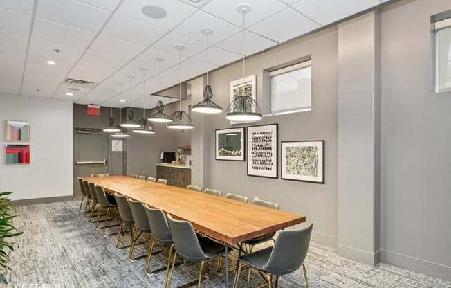 a conference room with a long table and chairs