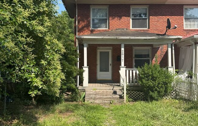 Northside Brick colonial with Front porch and modern finishes