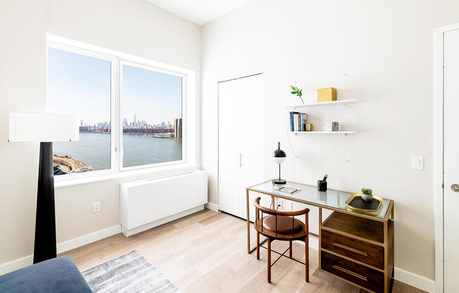 Home office apartment photo with southern river views.