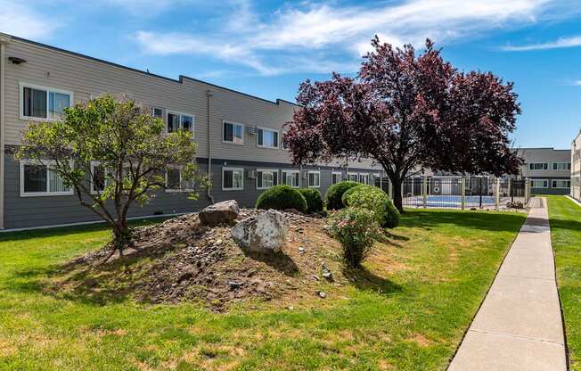 Americana | Outdoor Pool, Exterior Building and Walkway