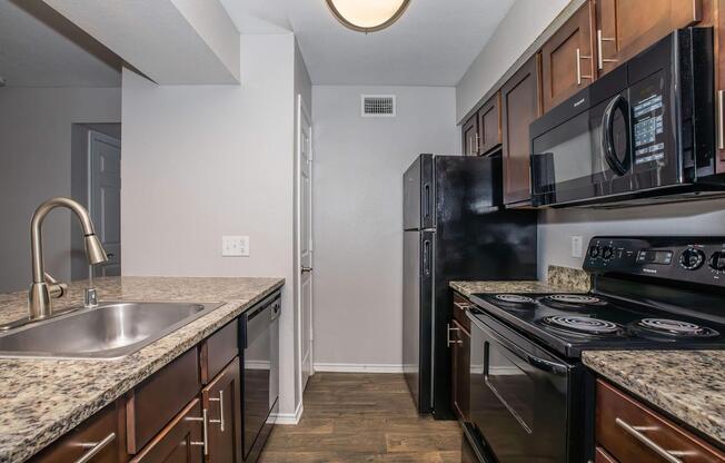 a large kitchen with stainless steel appliances