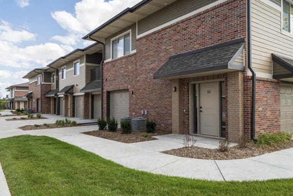 Private entrances and attached garages at The Villas at Falling Waters luxury townhomes in west Omaha NE