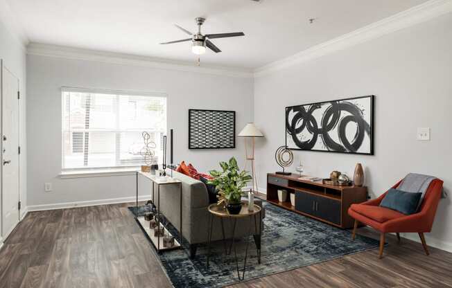 a living room with a couch and a chair and a table