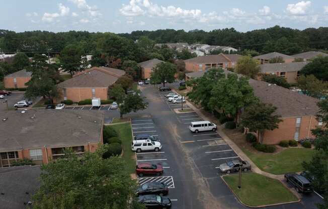 arial view of a neighborhood with brick buildings and trees