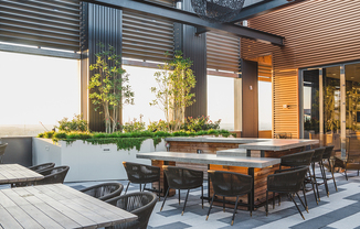 Rooftop courtyard at sunset with ample seating for great entertainment options