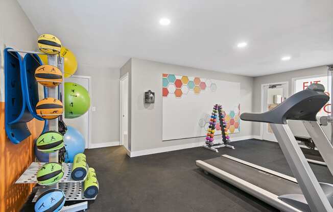 the gym at the enclave at woodbridge apartments in sugar land, tx