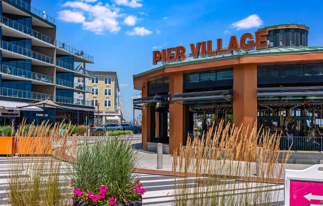 A building with the words "Pier Village" on it.